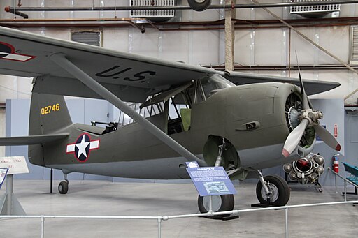 Curtiss O-52 Owl plane on display in an air hangar.